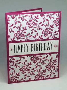 a happy birthday card with flowers on it