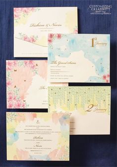 the wedding stationery is laid out on top of each other