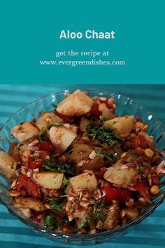 a glass bowl filled with food on top of a blue table