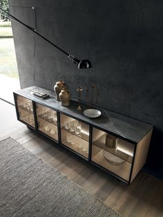 a black and white bathroom with a large mirror on the wall next to a sink