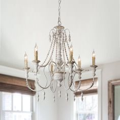 Lend striking visual appeal to your dining room or foyer with this chandelier. A durable wood frame ensures lasting quality, six lights surround the frame to emit glistening light throughout your space. Parrot Uncle 6-Light Distressed White French Country/Cottage Dry rated Chandelier | BB8817-6110V Farmhouse Chandelier Bedroom French Country, Modern French Country Chandeliers, French Country Chandelier Dining Room, French Farmhouse Lighting, French Country Light Fixtures, Farmhouse Chandelier Dining Rooms, Swag Chandelier