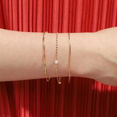 This Freshwater Pearl Delicate Chain Bracelet is the perfect way to channel your inner little mermaid! Strung with dainty pearls and a delicate chain, you'll be sure to make a splash wherever you go! The perfect accessory for those who love to add a touch of grace and elegance to their look! Gold Vermeil or Sterling Silver, Freshwater Pearl SKU: SAB-0028 Dainty Pearl Chain Bracelets For Party, Delicate Pearl Chain Bracelets For Party, Dainty Pearl Chain Bracelet For Party, Dainty Pearl Chain Bracelet With Jubilee Style, Pearl Bracelets With Delicate Chain For Gifts, Pearl Bracelet With Delicate Chain For Gift, Dainty Pearl Bracelet With Pearl Charm For Parties, Dainty Metal Pearl Bracelet Perfect As A Gift, Dainty Oyster Bangle Chain Bracelet