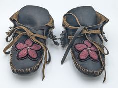 Men's or women's genuine buffalo leather moccasins with a securely sewn hand-beaded floral design.  These moccasins were authentically and beautifully handmade (all hand stitching) by Anishinaabe/ Ojibwe tribal artisans, Amy Clark, Heather Romero and Angel Roy of Pine Point Village, which is located within the White Earth Nation Reservation in Northern Minnesota.  The moccasins are 9 1/2 inches long and 4 inches wide.  Size 8/9 women's.  Size 7/8 men's. Indian Moccasins, Beaded Buffalo, Earth Nation, Native American Moccasins, Beaded Moccasins, Beaded Shoes, Northern Minnesota, Leather Moccasins, Buffalo Leather