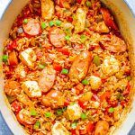 a large pan filled with rice and vegetables