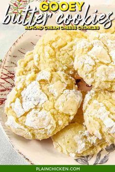 a plate filled with cookies covered in powdered sugar