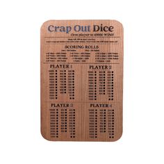 a wooden game board with the words crap out dice written in black ink on it