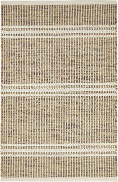 an area rug with brown and white stripes