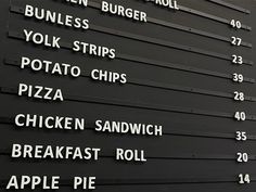 a menu board with many different types of food on it's sides and numbers