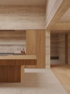 an empty kitchen with wooden cabinets and counter tops in a house that is designed to look like wood