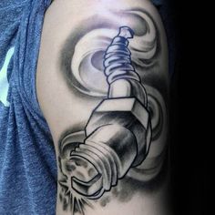 a man's arm with a tattoo on it and a lighter in the middle