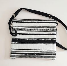 Going somewhere warm? Our black and white crossbody bag is the perfect addition to any outfit.  Credit card holder, key loop with a matching key lanyard. One pocket. 10.5" x 9.5" Black And White Rectangular Bags For Everyday Use, Black And White Rectangular Bag For Everyday Use, Rectangular Black And White Bag For Everyday Use, Rectangular Black And White Travel Bag, Utica Ny, Black And White Bags, White Crossbody Bag, Key Lanyard, Striped Bags