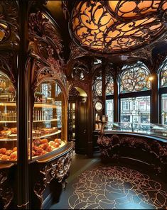 an ornately decorated bakery with many pastries in the display case and lights hanging from the ceiling