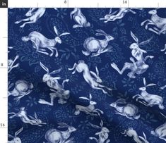 a blue background with white rabbits on it