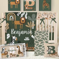 a baby's room with green and white wallpaper, jungle animals, giraffes and zebras