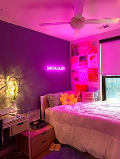 a bed room with a neatly made bed and purple walls