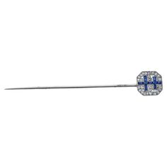 On of a Kind Stick Pin from the Early 20th century. The piece was crafted in 18k white gold featuring approximately 2.75 inches of pin for proper securing. The pave face of the pin features diamonds and sapphires in a double cross pattern. The face of the pin measures approximately 0.5 inches. A great piece for any lapel - men or women. Cross Patterns, Stick Pins, Early 20th Century, Black Diamond, French Antiques, The Face, 20th Century, Sapphire, Diamonds