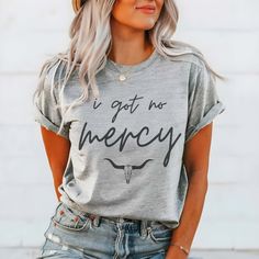 Gear up with our "I Got No Mercy" Comfort Color Tee, the ultimate choice for those who embrace their fierce and unapologetic attitude. Crafted for individuals who take on life with boldness and determination, this tee exudes confidence and attitude. Made from premium Comfort Color fabric, our tee ensures both comfort and durability, promising softness that lasts through every adventure. The "I Got No Mercy" design captures the fearless spirit within, evoking images of strength and resilience. Wh Comfort Color, Comfort Colors Tee, Fabric Color, Graphic Tees, Fabric