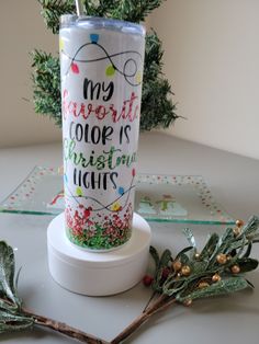 a christmas themed tumbler sitting on top of a table