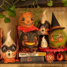 halloween decorations are displayed on a shelf