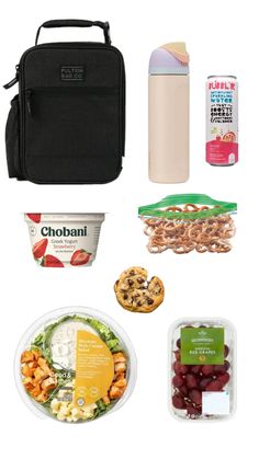 the contents of a lunch box including salad, fruit and yogurt are shown