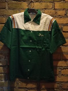 Vintage Hilton  Bowling shirts  Made in USA Size L Pit to pit 24 inch Length 28 inch  Pre owned condition Cotton .No Return .No Refund .Please read description and check out pictures before purchase SHIPPING - We ship use REGULAR shipping - ready to ship in 1-3 days - Delivery within 20 -30 working days Maybe more due to      because  inspection by the customs of destination country,   - with tracking number - with tracking number Please leave your phone number , as the shipping company always n Retro Green Cotton Top, Retro Green Cotton Shirt, Green Retro Cotton Shirt, Retro Collared Cotton T-shirt, Vintage Green Short Sleeve Camp Shirt, Retro Green Collared T-shirt, Vintage Green Collared T-shirt, Green Cotton Crew Neck Camp Shirt, Vintage Green Cotton Shirt