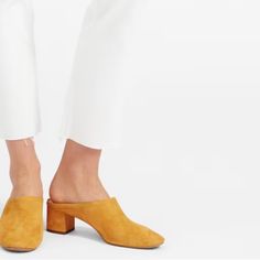 Everlane Yellow Suede Mules. Fun Take On The Day Heel, These Slide On Mules With Supportive Block Heel And Suede Are The Pop Of Color For Your Wardrobe. New Without Tagsthese Were The Floor Sample, So There Is A Mark On The Front Of The Toe, But They’ve Never Been Worn. Size 6 Gold Mules For Spring Workwear, Elegant Yellow Mules For Spring, Elegant Yellow Slip-on Heels, Chic Yellow Pointed Toe Mules, Elegant Yellow Suede Heels, Chic Yellow Heels For Fall, Gold Suede Heels For Spring, Everlane Shoes, Suede Mules