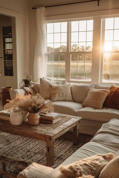 Sunlit farmhouse living room featuring cozy white sofas, rustic wooden coffee table, and soft accent pillows for warm farmhouse living room decor ideas. Vintage Simple Living Room, Cute House Interior Aesthetic Living Room, Traditional Farmhouse Decor Living Room, Cozy Country Home Living Room, Rustic Lounge Room Ideas, Farmhouse Interior Ideas Living Room, Cozy Rustic Apartment, Cottage Core Farmhouse Living Room, Fall Farmhouse Interior