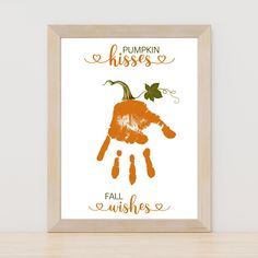 a pumpkin handprint with the words pumpkin kisses and fall wishes