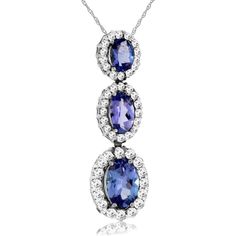 Royal 14K White Gold Tanzanite and Diamond Three-Stone Pendant Elegant Tanzanite Gemstones With Accent Stones, Elegant Tanzanite Gemstones For Formal Occasions, Formal Tanzanite Elegant Gemstones, Elegant Polished Diamond Gemstones, Elegant Tanzanite Gemstones With Halo Setting, Elegant Oval Tanzanite Gemstones, Elegant Round Tanzanite Gemstones, Tanzanite Pendant, Sophisticated Jewelry