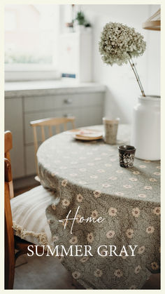 a table with a flower vase on it and the words home summer gray above it