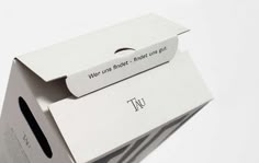 an open white box with the word tui on it's front and side