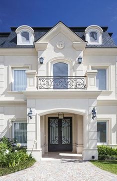 a large white house with a black door