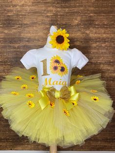 Sunflower Birthday Girl Tutu Set This listing is for the The pictured tutu set.  Please see my other listings for matching parents shirts. Please select size from the first drop down option. LS means Longsleeve. SS means Short sleeve. Size up to 24 months will be done on a Onesie 2T and larger will be done on a Tshirt.  Please select the pieces you want from the second  drop down options. 3pc set includes Onesie/Shirt, Tutu, and Headband. You can choose any combination of them in the drop down option. Please put the child's name and age you would like on the shirt in the personalization section.  Matching Parent and Relative Shirts https://www.etsy.com/listing/1494155731/sunflower-birthday-tshirt-mommy-daddy This item is custom cut and personalized so it is non returnable. But if there is Sunflower Girl, Girl Tutu, Birthday Tshirts, Tutus For Girls, First Second, One Drop, Girls Clothing Sets, Clothing Sets