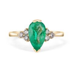 This ring features a 1.10-carat natural Colombian emerald, pear cut from the famous Muzo mines. Set in a secure two-prong setting, this extraordinary emerald has a stunning green color and very good eye clarity, Minor imperfections are normal for genuine Colombian emeralds. Three brilliant round diamonds accent the emerald on either side. Excellent colorless diamonds with VS clarity highlight the pear cut emerald. Set in silky 14K yellow gold. Perfect for everyday wear. Metal Purity: 14K Yellow, Pear-shaped Brilliant Cut Emerald Ring, Green Pear-shaped Diamond Ring, Green Teardrop Emerald Ring With Brilliant Cut, Teardrop Emerald Ring With Prong Setting, Pear-shaped Green Emerald Diamond Ring, Pear-shaped Emerald Gemstone Ring, Pear-shaped Brilliant Cut Green Emerald Ring, Green Pear-shaped Brilliant Cut Emerald Ring, Classic Pear-shaped Green Ring