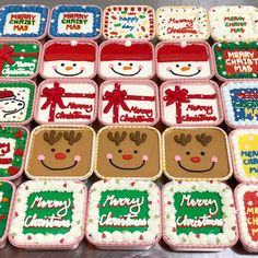 many decorated cookies are arranged in rows on a table with snowman and reindeer faces