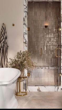 a bath room with a tub and a shower head mounted to the side of a wall