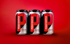 three cans of red and white liquid on a red background with the words p2