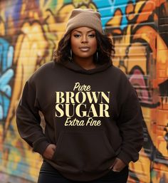 "Women's melanin inspirational hoodie Pure Brown Sugar Extra Fine  Wrap yourself in empowerment with our \"Pure Brown Sugar Extra Fine\" Women's Inspirational Hoodie, a chic blend of cozy streetwear and melanin vibes. This hoodie is a celebration of comfort, confidence, and elegance. The extra fine knit fabric offers a gentle hug of softness, enhancing your street style with a rich brown sugar hue that complements and celebrates melanin beauty. 🥇 Premium Comfort: Uncover the epitome of comfort with the Gildan 18500 Hoodie. Crafted from a premium blend of 50/50 cotton and polyester, it strikes the perfect balance. The luxurious feel, warm insulation, and breathability are woven into every thread. Elevate your hoodie game where cozy meets luxury. 8-ounce, 50/50 cotton/poly Double-needle sti Gildan Hoodie, Costume Parties, Cozy Fits, Music Festivals, Stepping Out, Fabric Names, Casual Hoodie, Monday Friday, Costume Party