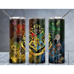 three harry potter tumblers are shown on a table