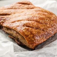 a piece of meat sitting on top of wax paper