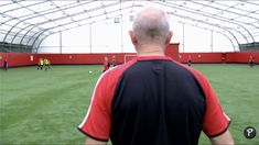 a man standing on top of a soccer field