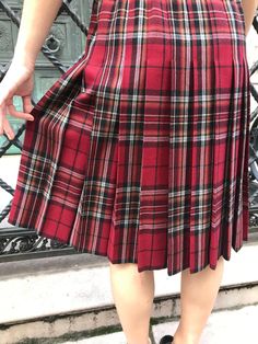 70's Yves Saint Laurent red plaid skirt, 100% wool, back of skirt is pleated, overlapping closure. Size M, Waist 14-15, length 24 Scottish Style Fitted Pleated Skirt For Fall, Fall Scottish Pleated Skirt, Red Fitted Pleated Skirt For Fall, Fitted Red Pleated Skirt For Fall, Retro Plaid Pleated Skirt For Fall, Scottish Style Pleated Skirt For Fall, Retro Accordion Pleated Skirt For Fall, Scottish Red Skirt For Fall, Vintage Plaid Pleated Skirt For Fall