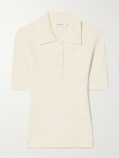 Like all of the brand's designs, Sporty & Rich's polo shirt is a great choice for casual days. It's ribbed-knitted for a close fit and has a tonal logo patch appliquéd on the chest. Undo a few of the buttons to enhance the relaxed feel. White Ribbed Polo Collar Top, White Ribbed Top With Polo Collar, Trendy Fitted Polo Sweater For Work, Fitted Ribbed Short Sleeve Polo Shirt, Ribbed Cotton Short Sleeve Polo Shirt, Trendy Fitted Polo Sweater With Ribbed Collar, White Ribbed Polo Sweater For Spring, Fitted Polo Shirt With Seamless Collar For Fall, Fitted Cotton Polo Shirt For Fall