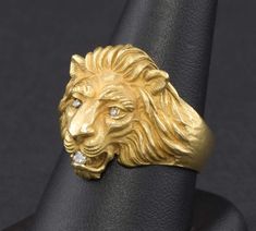 "I'm delighted to offer one of Baumstein Feder's original gold Lion rings from the 1950's.  Many manufacturers made inferior copies of this magnificent lion over the years, and when you see the wonderful details and impressive presence of this ring it's easy to see why. (Baumstein Feder was located in NY and known for their high quality pieces and gems.  In the 50's they commissioned an artist in Italy to sculpt the design for this lion - they also made a snake and bear - that was then cast and Lion Ring, Gold Lion, Antique Pendant, Vintage Jewels, Round Brilliant Cut Diamond, Brilliant Cut Diamond, Gold Bands, Lion, Vintage Rings