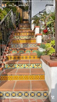 the stairs are decorated with colorful tiles