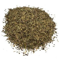 a pile of dried herbs on a white background