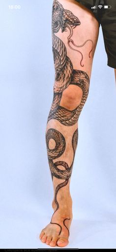 a man with a tattoo on his leg