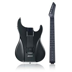 an electric guitar with a black body and pickguard on the top, next to it's stand