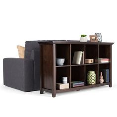 a living room with a couch, chair and bookcase on the floor in front of a white background