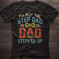 Shirts For Step Dads, Stepfather Shirt, I'm Not The Step Dad I'm Just The Dad That Stepped Up Unisex T-shirt, Step Dad Fathers Day Gift ABOUT OUR PRODUCTS: The personalized Standard T-Shirt is the perfect canvas for self-expression and individual style. Crafted from 100% preshrunk cotton, this classic short-sleeve tee not only offers comfort but also provides a unique opportunity for print on demand customization. Whether you're looking to showcase your creativity, promote your brand, or commemo Black Slogan Shirt For Father's Day, Father's Day Black Shirt With Funny Text, Father's Day Black Slogan Shirt, Black Shirt With Funny Text For Father's Day, Black Shirt With Text Print For Father's Day, Black Slogan Top For Father's Day, Father's Day Funny Text Short Sleeve Top, Funny Text Short Sleeve Tops For Father's Day, Funny Short Sleeve Tops For Father's Day